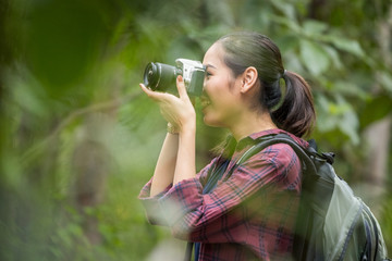 Photographer woman asian woman taking a photos with dslr camera professional photography during her vacation, Concept of woman solo travel