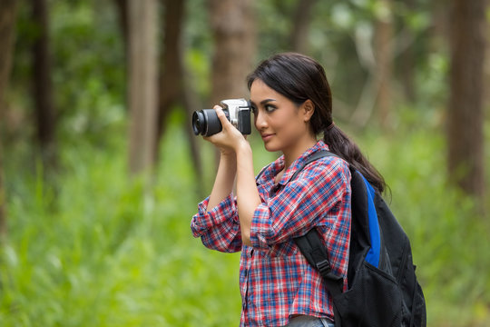 Photographer woman asian woman taking a photos with dslr camera professional photography during her vacation, Concept of woman solo travel