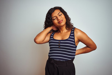 Transsexual transgender woman wearing striped t-shirt over isolated white background Suffering of neck ache injury, touching neck with hand, muscular pain