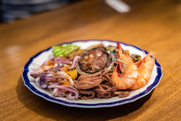 eat plate of seafood on table