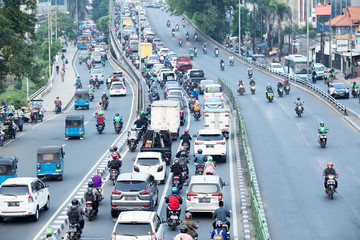 Highway with crowded cars and motorcycles