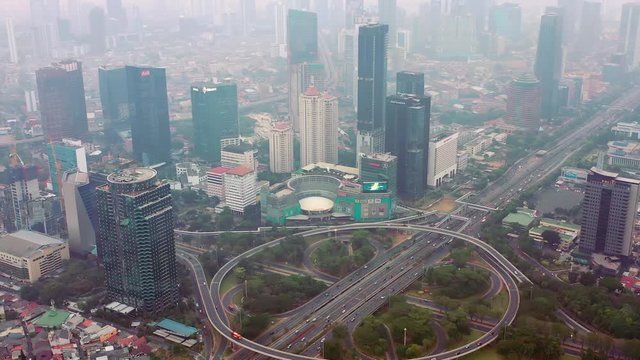 Aerial View of Jakarta City around Semanggi Interchange, showing extreme air pollution