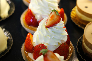 strawberry pie with whipped cream sold in bakery