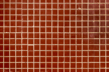 Background, wall on lined with fine brown tiled tiles.