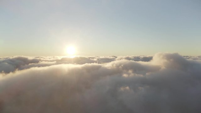 4K Aerial Drone Footage Flying Above The Clouds And Towards The Sunrise In Bali Indonesia