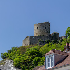 Fototapeta na wymiar The tower of Chateau de La Roche-Guyon is perched atop the hill above the village of the same name