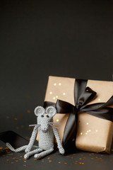 Christmas background. Xmas rat, mouse toy, symbol chinese happy new year 2020. Close up mouse toy and new year gift box. horoscope sign 2020. Copy space