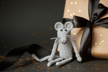Christmas background. Xmas rat, mouse toy, symbol chinese happy new year 2020. Close up mouse toy and new year gift box. horoscope sign 2020. Copy space