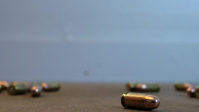 rolling handgun bullets rolling on the table