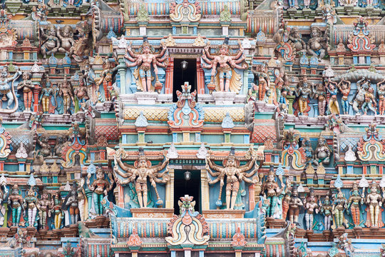 Hundreds of deity statues adorn the ancient Meenakshi temple in Madurai, Tamil Nadu, India