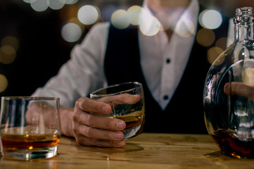 bartender pouring beer in a glass