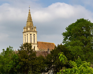 Fototapeta na wymiar The bell tower of the Church of Saint Christopher is visible from many places in Cergy, France
