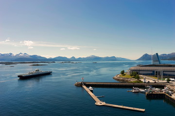 Sunset in Molde Bay and Aker Stadion in the background. Romsdal, Norway. View from open deck of...