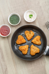 Heart shape cutlets with sauce and green chutney