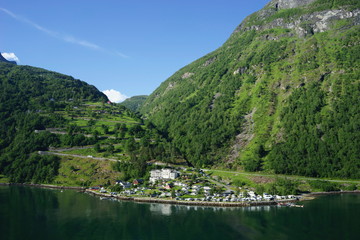 Fototapeta premium Geiranger is a small tourist village in Sunnmore region of Norway. Geiranger lies at the Geirangerfjord.