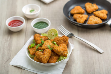 Heart shape cutlets with sauce and green chutney