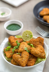 Heart shape cutlets with sauce and green chutney