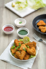 Heart shape cutlets with sauce and green chutney