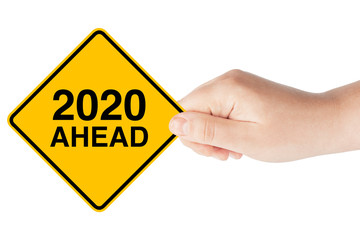 2020 Year Ahead Traffic Sign in Woman's Hand