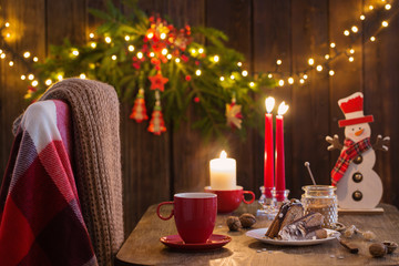 wooden table with Christmas cake and decor