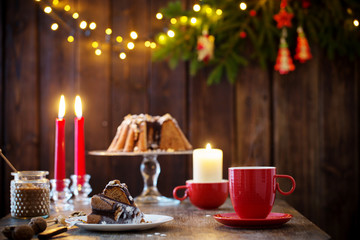 wooden table with Christmas cake and decor