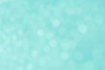 Abstract blurred and bokeh of thinly droplets and reflection lighting on blue background.