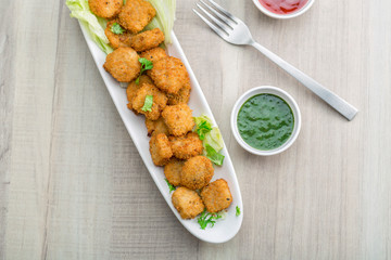 Button cutlets with sauce and green chutney