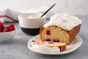 Cake with raspberries and whipped cream. Copy space.