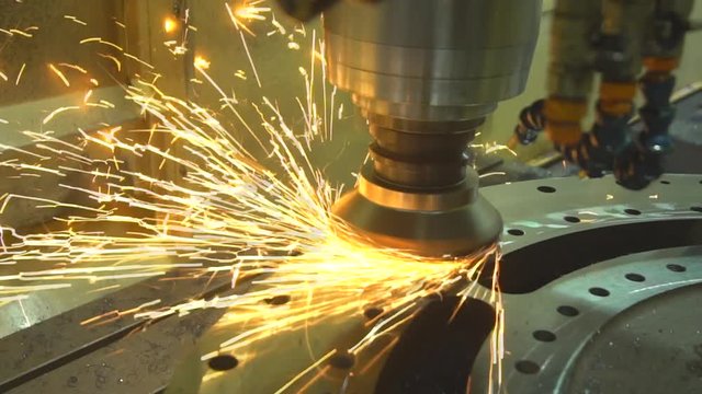 Close-up shot of CNC machine automated milling machine doing precise cut in the warehouse (Kilang di Malaysia)