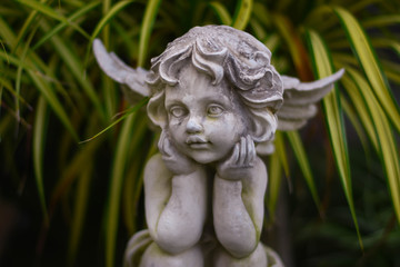 Obraz premium Stucco doll, Cupid, the god of conveying love in Western beliefs