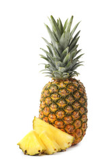 Fototapeta na wymiar Tasty raw pineapple with slices on white background