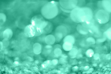Mint Christmas background from sparkles. Blurred abstract textures.