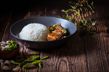 Thai food, Rice topped with stir fried basil and pork bone.