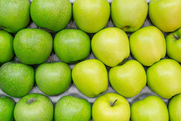 Ripe green apples. Harvest of autumn in the store.