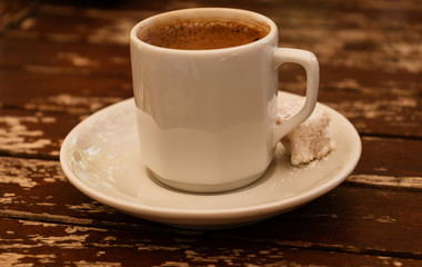 cup of coffee on wooden table