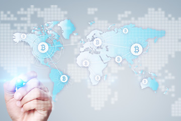 Fototapeta premium World map with bitcoin icons on virtual screen. Crypto currency. Blockchain technology. Internet payments.