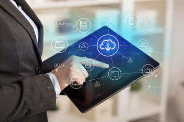 Business woman using tablet with network security and online storage system concept