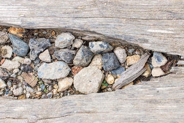 Wooden footpath structure with stone elements
