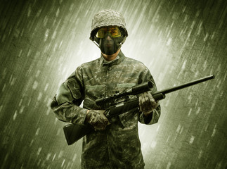 Armed soldier standing in rainy weather