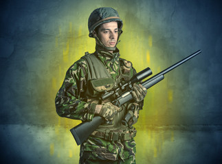 Hazard, menace soldier in a ruined crumbly building with arms on his hand