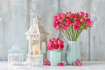 Bouquet of pink roses in blue ceramic vase