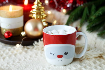 Obraz na płótnie Canvas christmas background in gold and red colors decorations and cup of coffee with marshmallows .Xmas, holiday and celebration concept for postcard or invitation. Copy space 