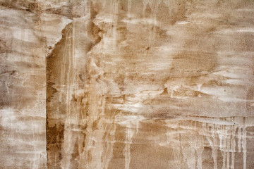 Texture of a concrete wall with cracks and scratches which can be used as a background