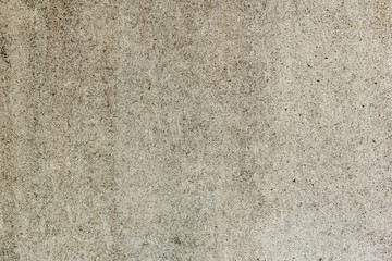 Texture of a concrete wall with cracks and scratches which can be used as a background