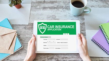 Car insurance application form on screen. Internet and business concept.