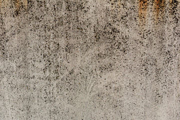 Texture of a concrete wall with cracks and scratches which can be used as a background