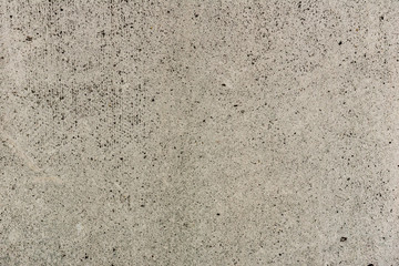 Texture of a concrete wall with cracks and scratches which can be used as a background