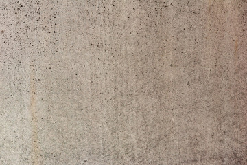 Texture of a concrete wall with cracks and scratches which can be used as a background