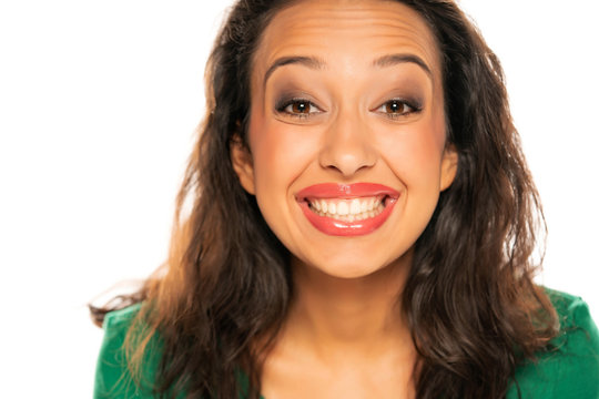 Dark skinned woman showing her healthy teeth