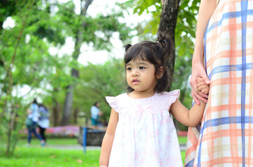 Little Child Girl and Mother at The Public Park